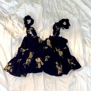 Black Crop Top with Beige Flower Pattern.